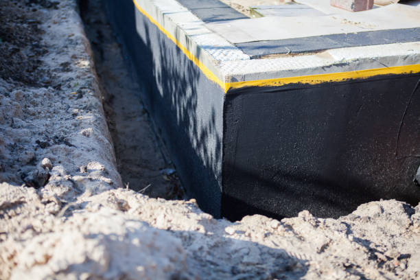 Professional Basement Waterproofing technician working in Mottville, NY